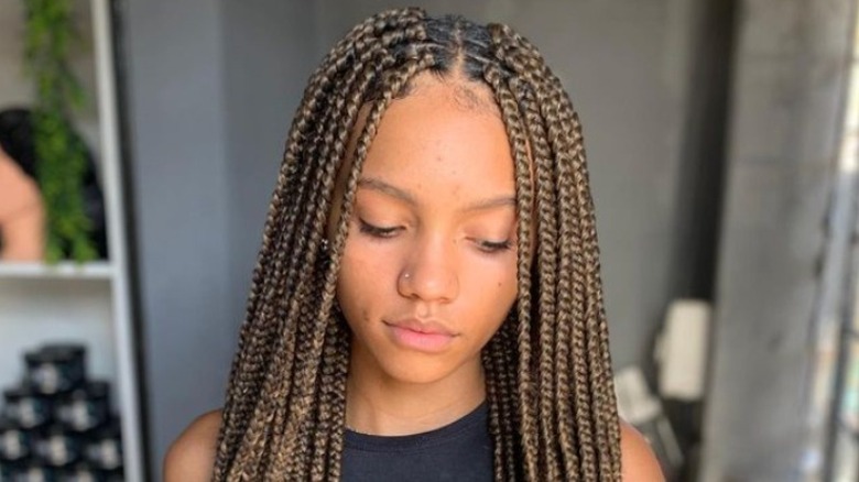 Woman with brown box braids