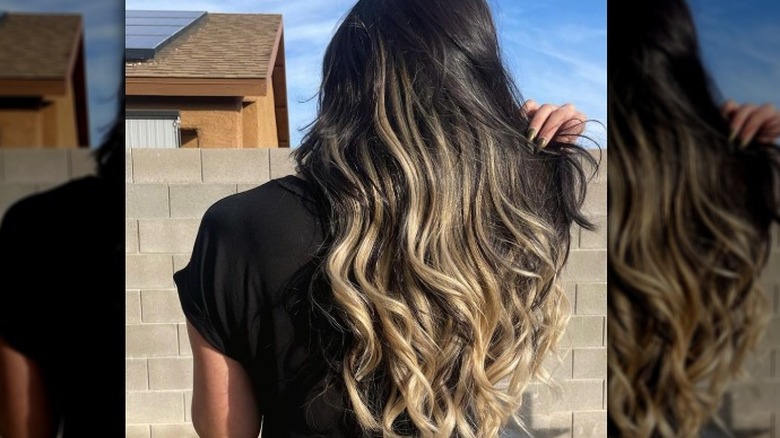 Person with long curled hair