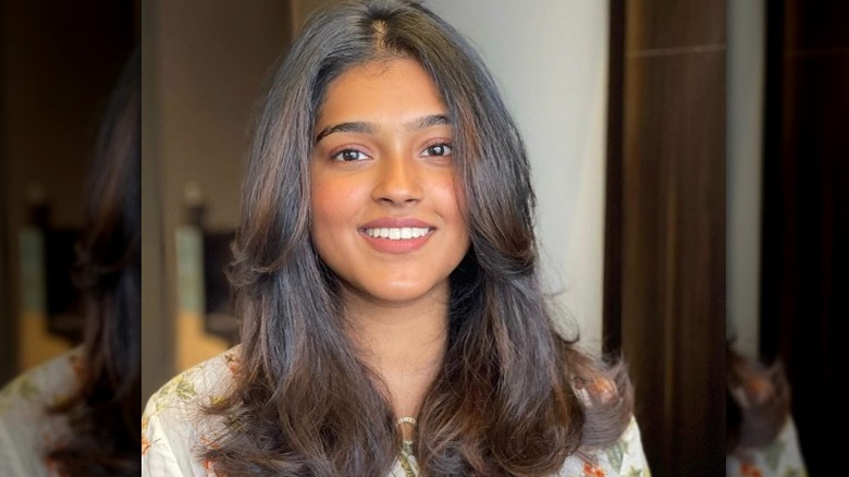 Woman with brown hair smiling