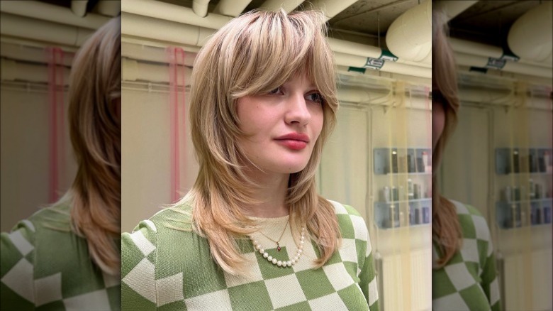 layered hair cut checkered shirt