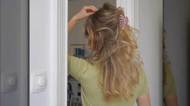 Woman with half-up hair secured with clip