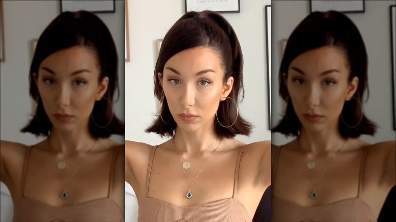 Woman doing Bella Hadid-inspired tutorial