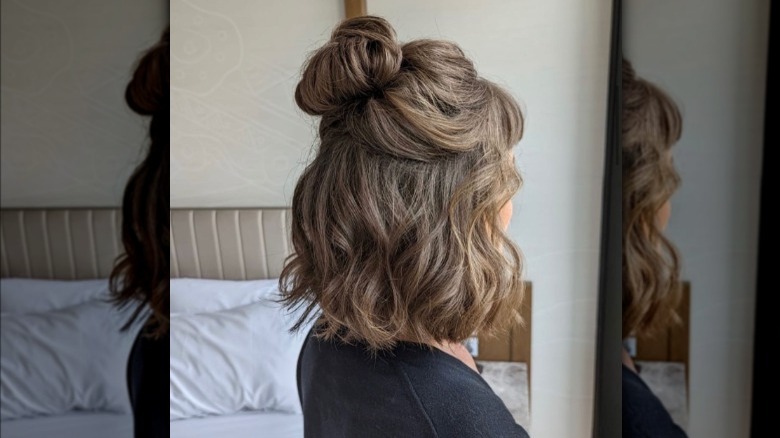 Woman with long bob and half top knot