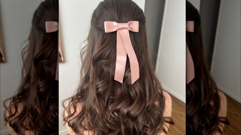 Woman with pink bow in hair