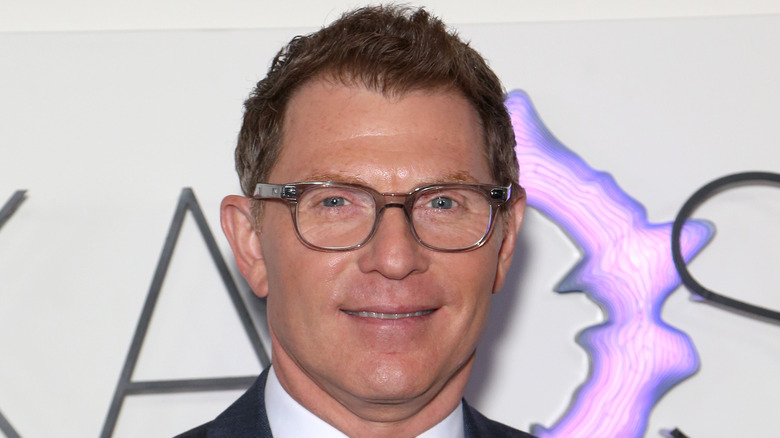 Bobby Flay smiles on the red carpet