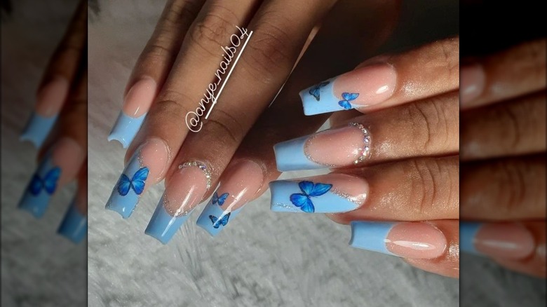 Blue tip butterfly dip nails