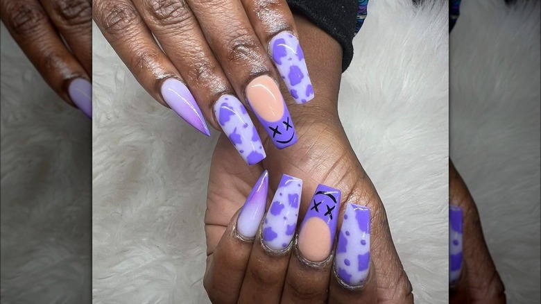 Purple cow print dip nails