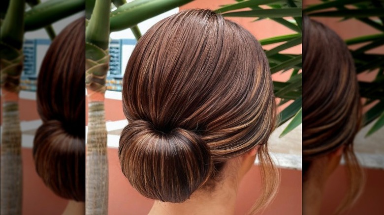 chignon hairstyle on brunette woman