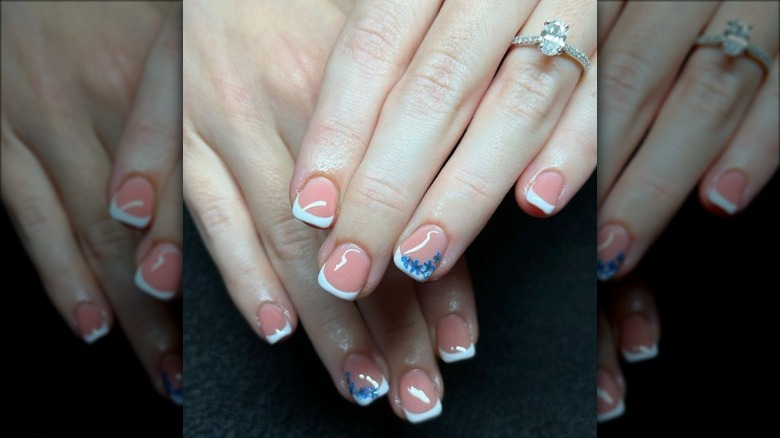 french manicure with blue flowers