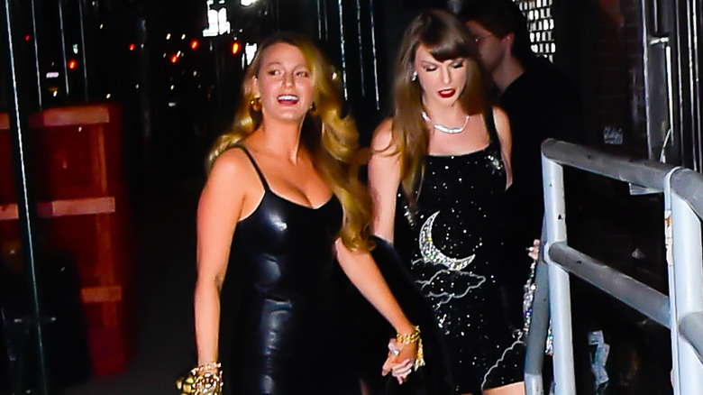 Blake Lively holding hands with Taylor Swift