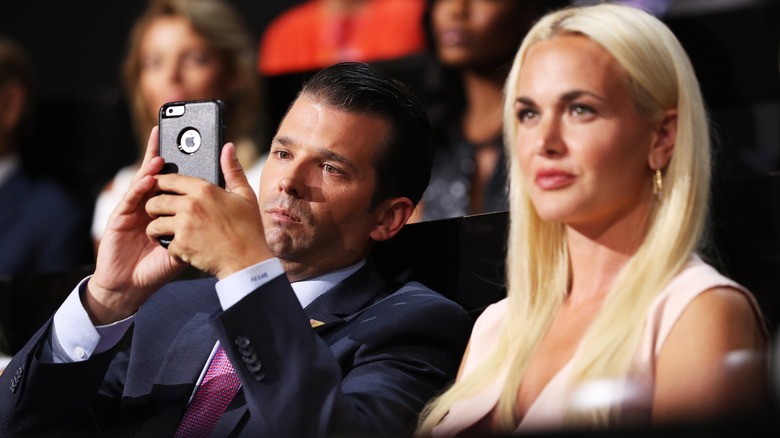 Vanessa Trump and Don Jr. at an event while Don Jr. checks his phone