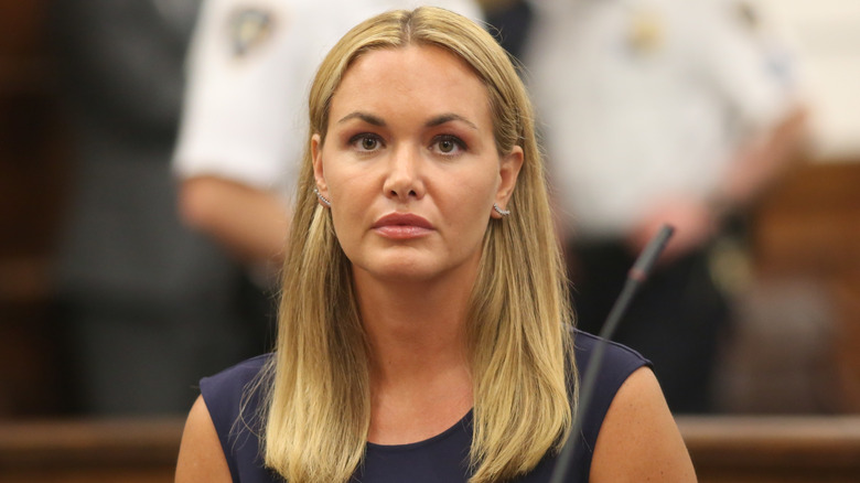 Vanessa trump withher hair tucked behind her ears in court