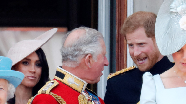 King Charles III turns to speak to Prince Harry, Duke of Sussex