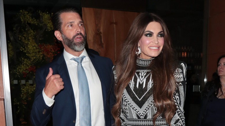 Donald Trump Jr. standing beside smiling Kimberly Guilfoyle