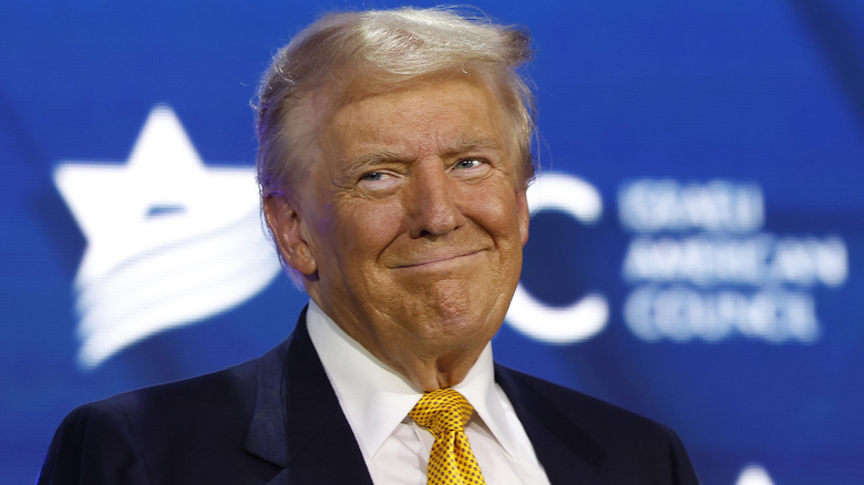 Donald Trump smug smile yellow tie