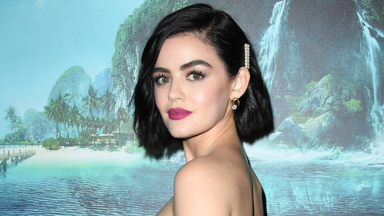 Lucy Hale posing on the red carpet