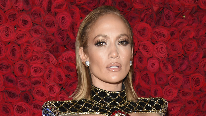 Jennifer Lopez in front of roses