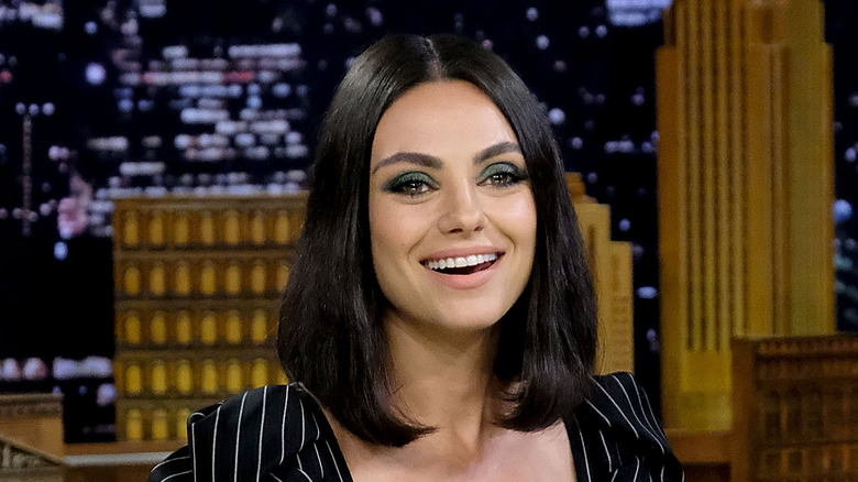 Mila Kunis smiling on talk show