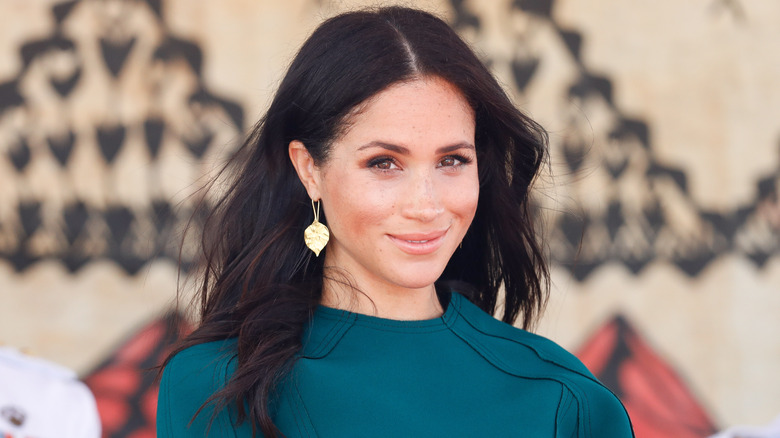 Meghan Markle smiling at an event