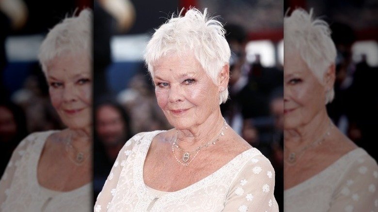 Judy Dench smirking