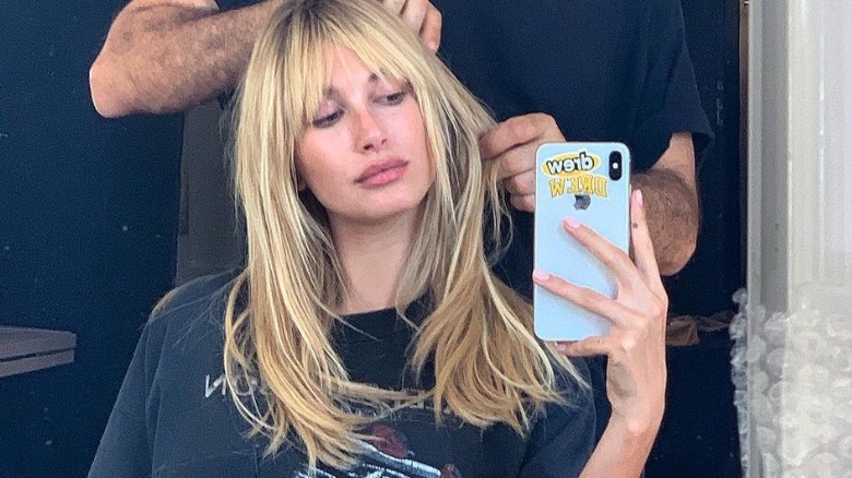 Hailey Bieber taking selfie