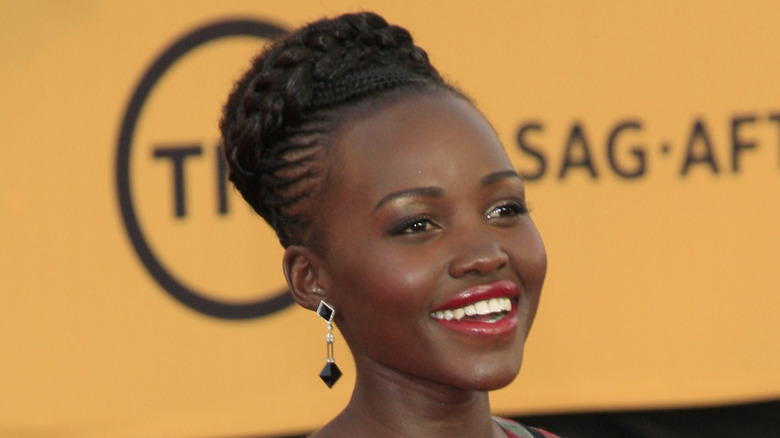 Lupita Nyong'o wearing red lipstick