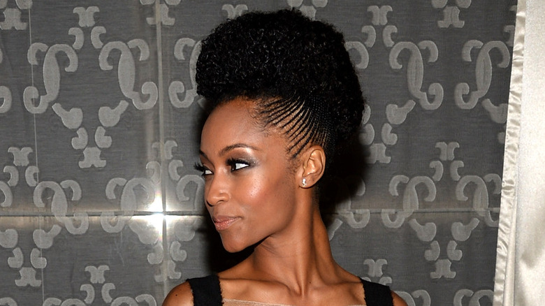 Yaya DaCosta looking to the side