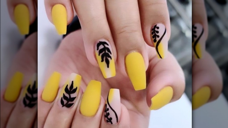 Yellow and black nail art