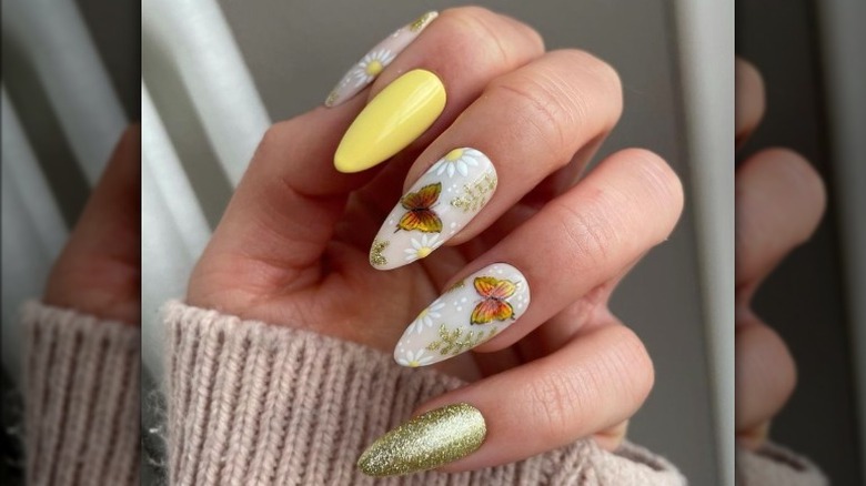 Hand with butterfly nail art