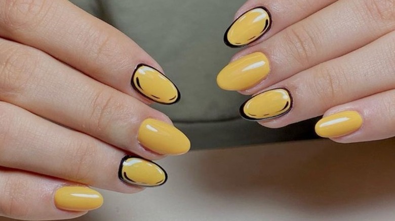 Yellow and black nail art