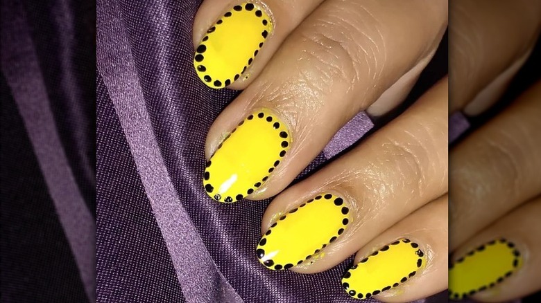 Yellow and black nail art