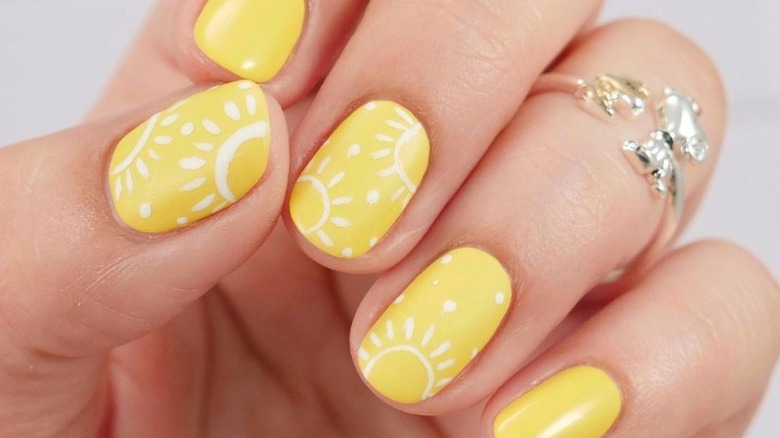 Yellow and white sun nail art
