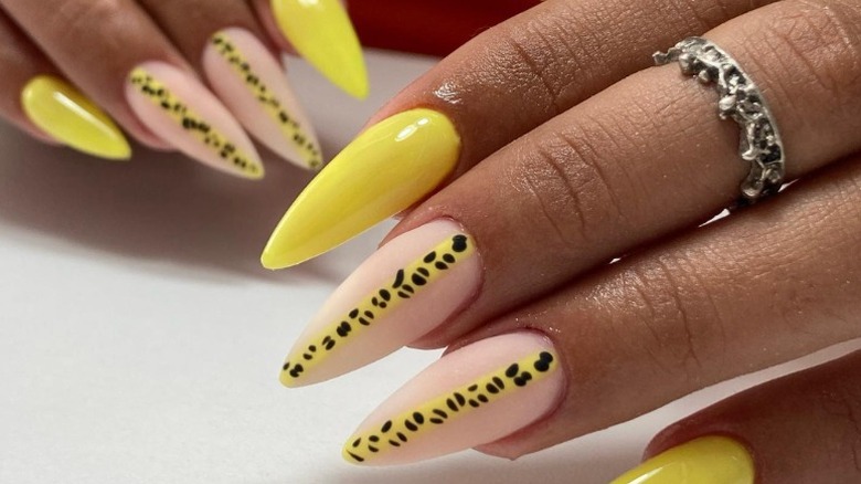Closeup of yellow leopard print nail art