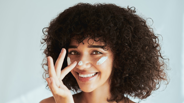 Woman applying cream