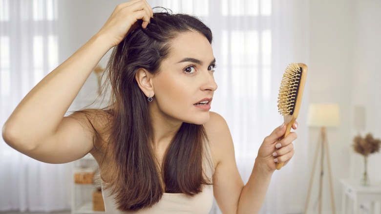 Woman looking at hairline