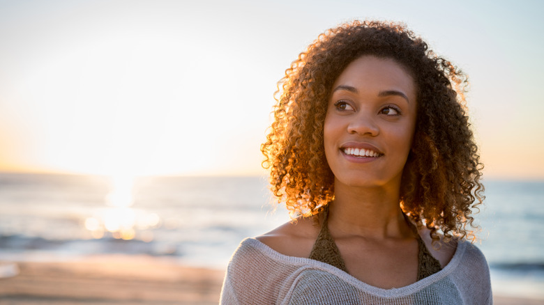 Woman at beach smiling