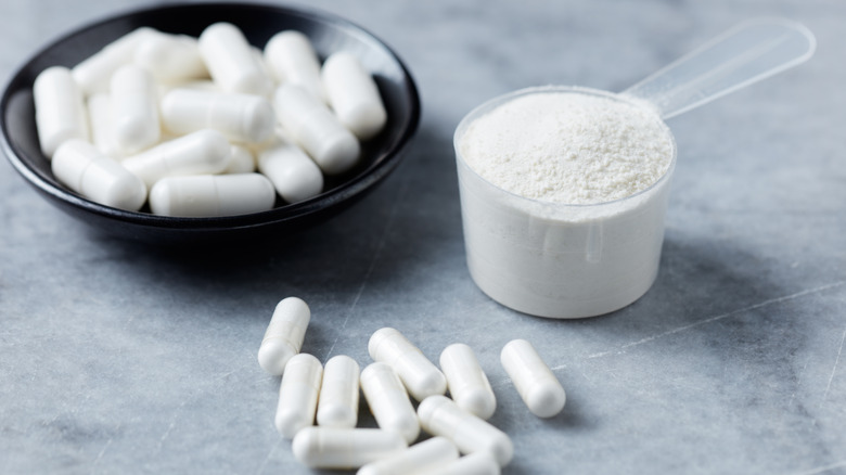 White powder substance and pills on table