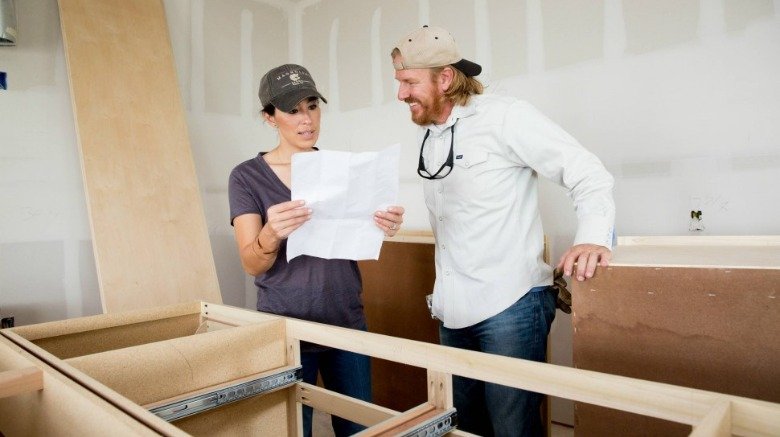 Chip and Joanna Gaines reviewing plans