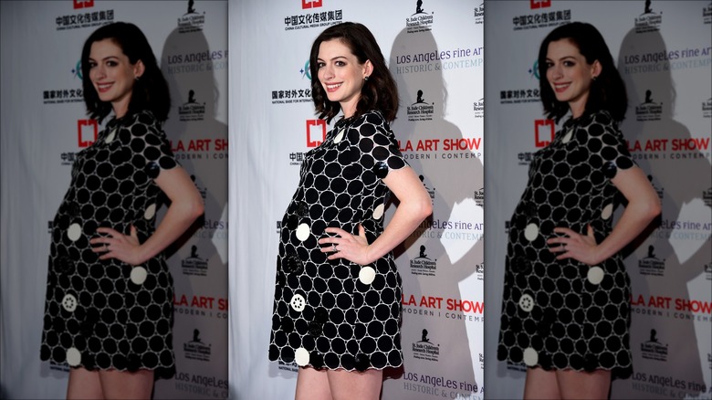 Anne Hathaway smiling on the red carpet