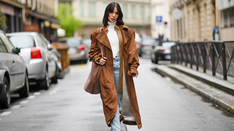 Woman wearing brown trench coat