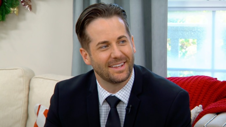 Niall Matter smiling in suit