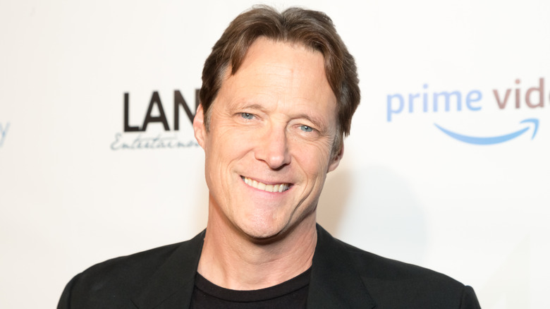 Matthew Ashford smiling at event