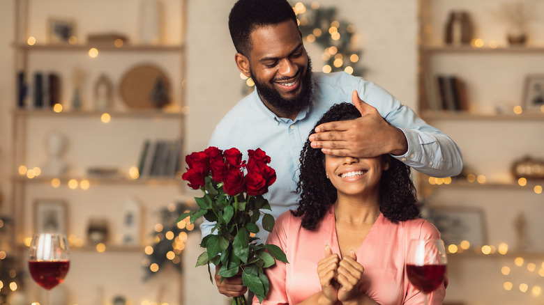 husband surprising wife at the holidays