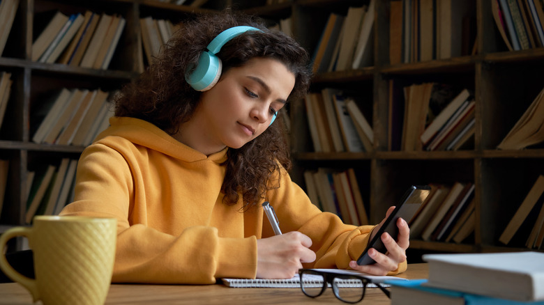 Teen girl using mobile app