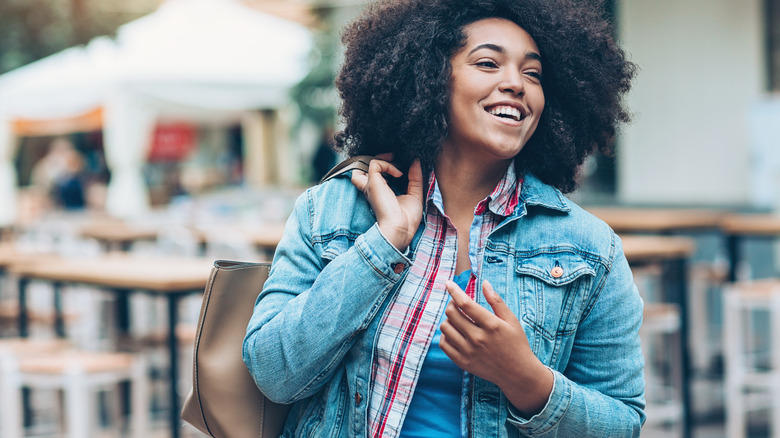 Woman smiling in jean jacket