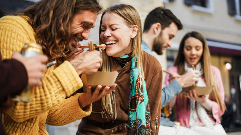 A group of friends eating takeout 