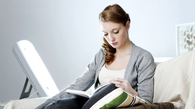 A woman using light therapy