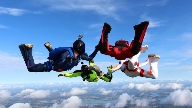 Four people skydiving