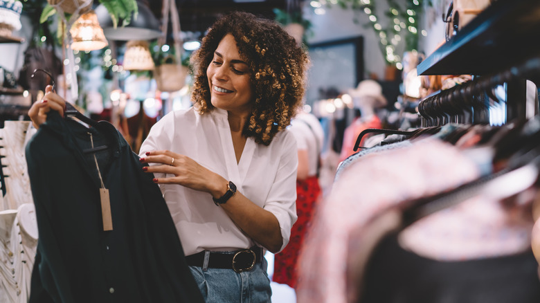 Woman browsing clothes at a store