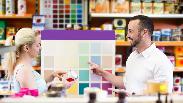 two people at a paint store